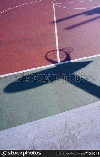 basketball hoop shadow silhouette on the court on the street