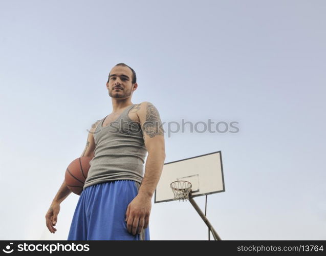 basketball player practicing and posing for basketball and sports athlete concept