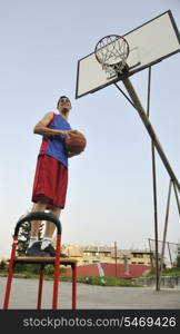 basketball player practicing and posing for basketball and sports athlete concept