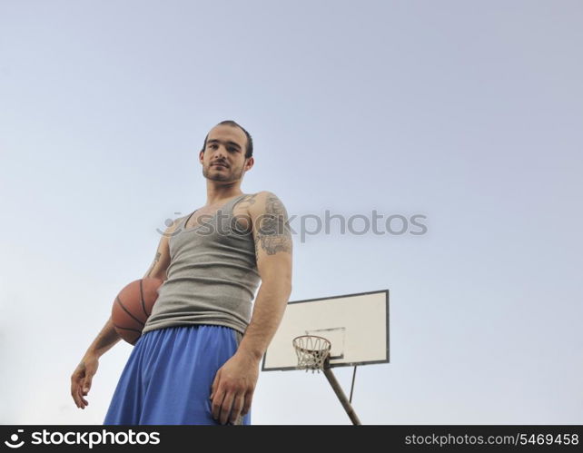 basketball player practicing and posing for basketball and sports athlete concept