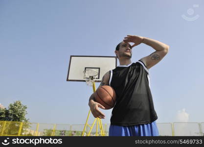 basketball player practicing and posing for basketball and sports athlete concept