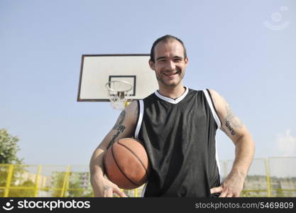 basketball player practicing and posing for basketball and sports athlete concept