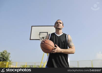 basketball player practicing and posing for basketball and sports athlete concept