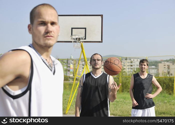 basketball player team group posing on streetbal court at the city on early morning