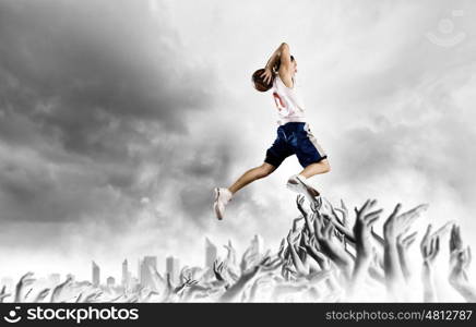 Basketball player. Young man basketball player with ball in hands jumping high