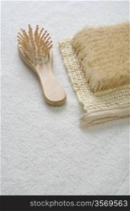 bast and hairbrush on towel