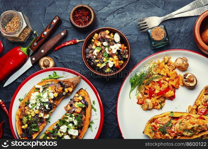 Batata stuffed with vegetables and cottage cheese and baked in halves. Diet food, baked vegetable, sweet potato. Sweet potato stuffed with vegetables and cottage cheese.