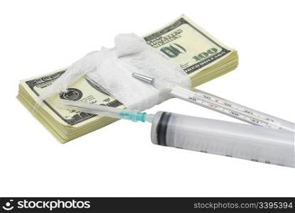 batch of false 100 dollar bills bandaged and with glass thermometer and syringe laying on it against white background, isolated