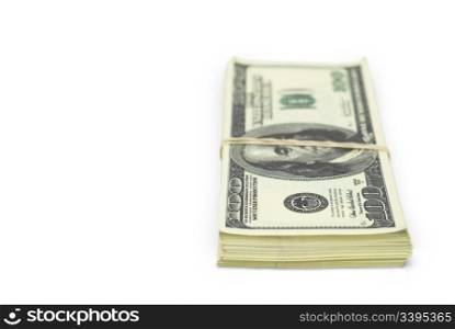 batch of false 100 dollar bills tied with rubber band against white background and copy space on the left