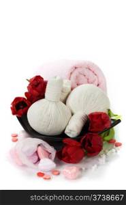 Bath and spa Valentine theme with thai herbal compress stamps, towel, bath soaps and tulips