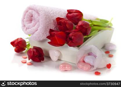 Bath and spa Valentine theme with towel, bath soaps and tulips