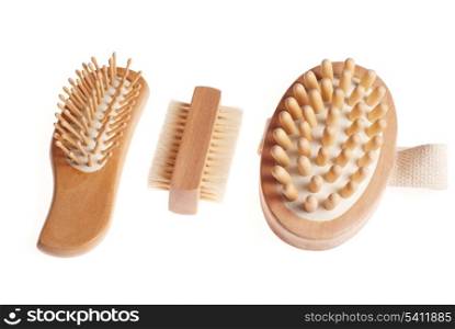 Bath anti-cellulitis spa massage kit with comb, brush and hairbrush isolated on white background.