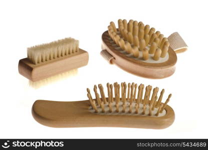 Bath anti-cellulitis spa massage kit with comb, brush and hairbrush isolated on white background.