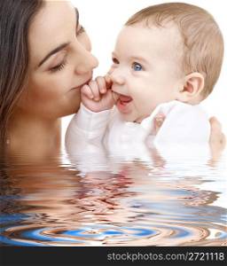bathing baby in mother hands