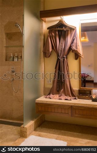 bathrobe hanged in spa room