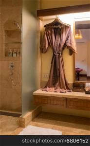 bathrobe hanged in spa room
