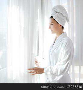 Bathrobe happy woman sunny hotel window white curtains