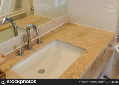 Bathroom sinks and luxury marble counter.