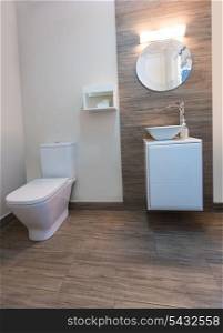 Bathroom toilet with round mirror modern indoor with ceramic stone