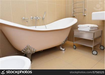 bathroom with terracotta tiles and bathtub