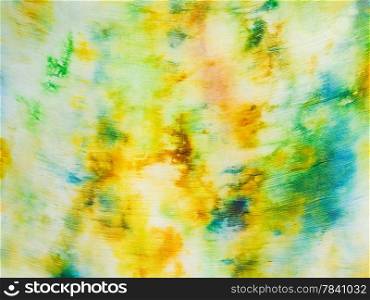 batik - abstract yellow and green painted pattern on silk fabric