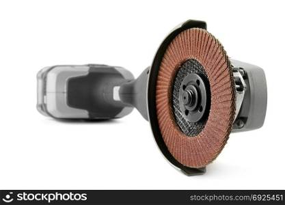 Battery angle grinder isolated on white background. Focus on foreground
