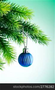 Baubles on christmas tree in celebration concept