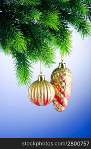 Baubles on christmas tree in celebration concept