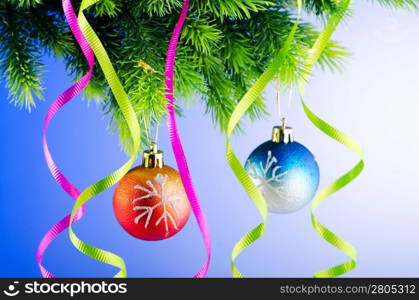 Baubles on christmas tree in celebration concept