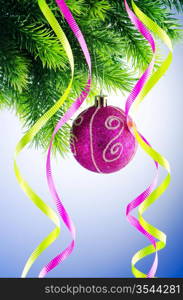 Baubles on christmas tree in celebration concept