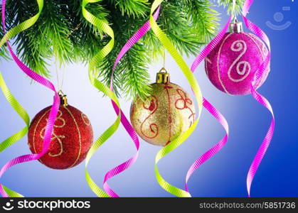 Baubles on christmas tree in celebration concept