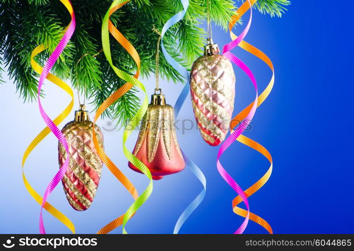 Baubles on christmas tree in celebration concept