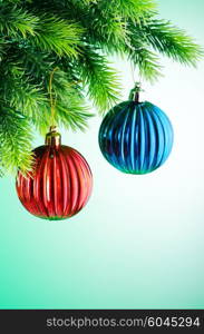 Baubles on christmas tree in celebration concept