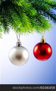 Baubles on christmas tree in celebration concept