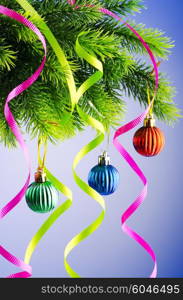 Baubles on christmas tree in celebration concept