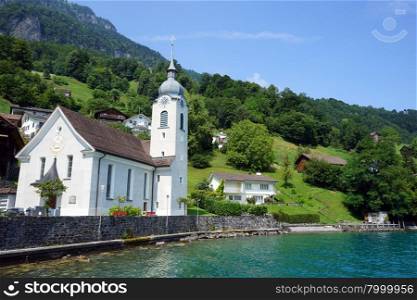 BAUEN, SWITZERLAND - CIRCA AUGUST 2015 Church and houses