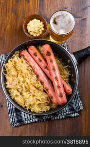 Bavarian fried sausages on sauerkraut