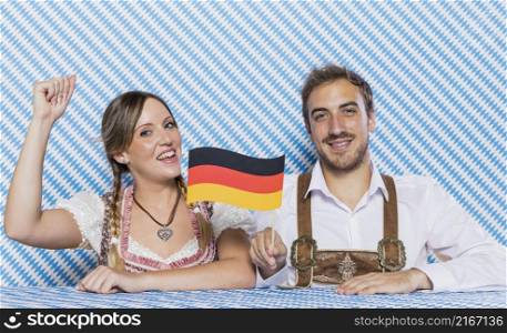bavarian friends holding german flag