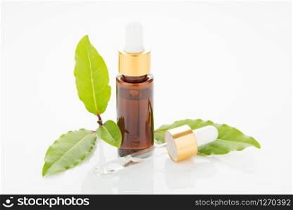 Bay essential oil bottle with dropper isolated on white background
