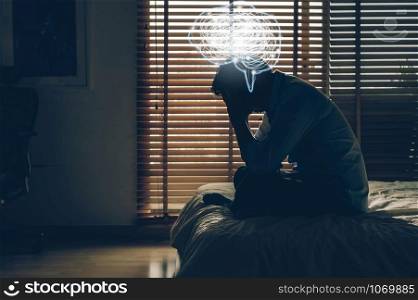 bdepressed man sitting head in hands on the bed in the dark bedroom with low light environment and and Polygonal brain shape with tangle doodle, Depress and stressed concept