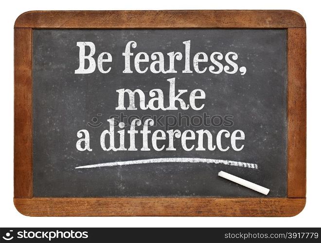 Be fearless, make a difference - motivational text on a vintage slate blackboard