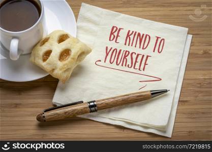 be kind to yourself inspirational reminder - handwriting on a napkin with coffee, self care, healthy lifestyle and personal development concept
