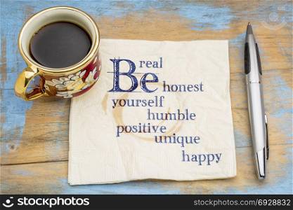 Be real, honest, humble, positive, unique, yourself and happy - handwriting on a napkin with a cup of coffee