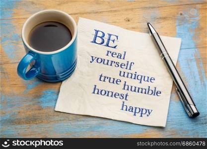 Be real, yourself, unique, true, humble, honest and happy - inspirational handwriting on a napkin with a cup of espresso coffee