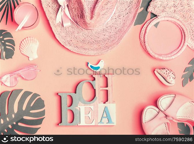Beach accessories in pastel color: straw hat, sunglasses, sandals , bag and palm leaves. Top view. Flat lay . Summer background with word beach