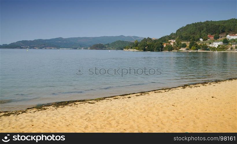 Beach along the bay Ria de Vigo, Cesantes, Spain