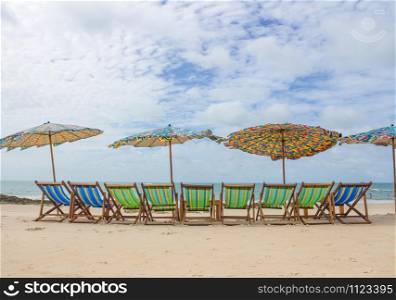 Beach and chair on sand beach. Concept for rest, relaxation, holidays, spa, resort.