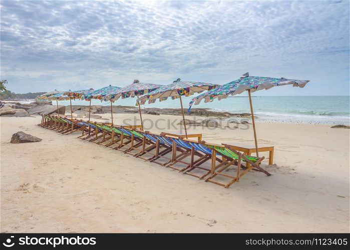 Beach and chair on sand beach. Concept for rest, relaxation, holidays, spa, resort.