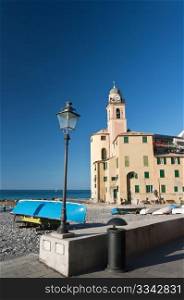 beach and church in Camogli, famous small town in Mediterranean sea, Italy