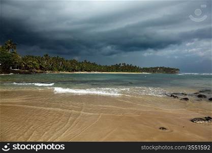 Beach and gathering storm. Mirirssa, Sri Lanka